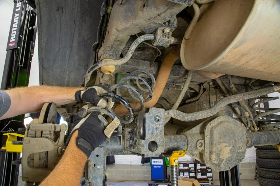 Jeep Wrangler JL 2" Rancho Lift Kit How-To remove-rear-coil-jl-rubicon