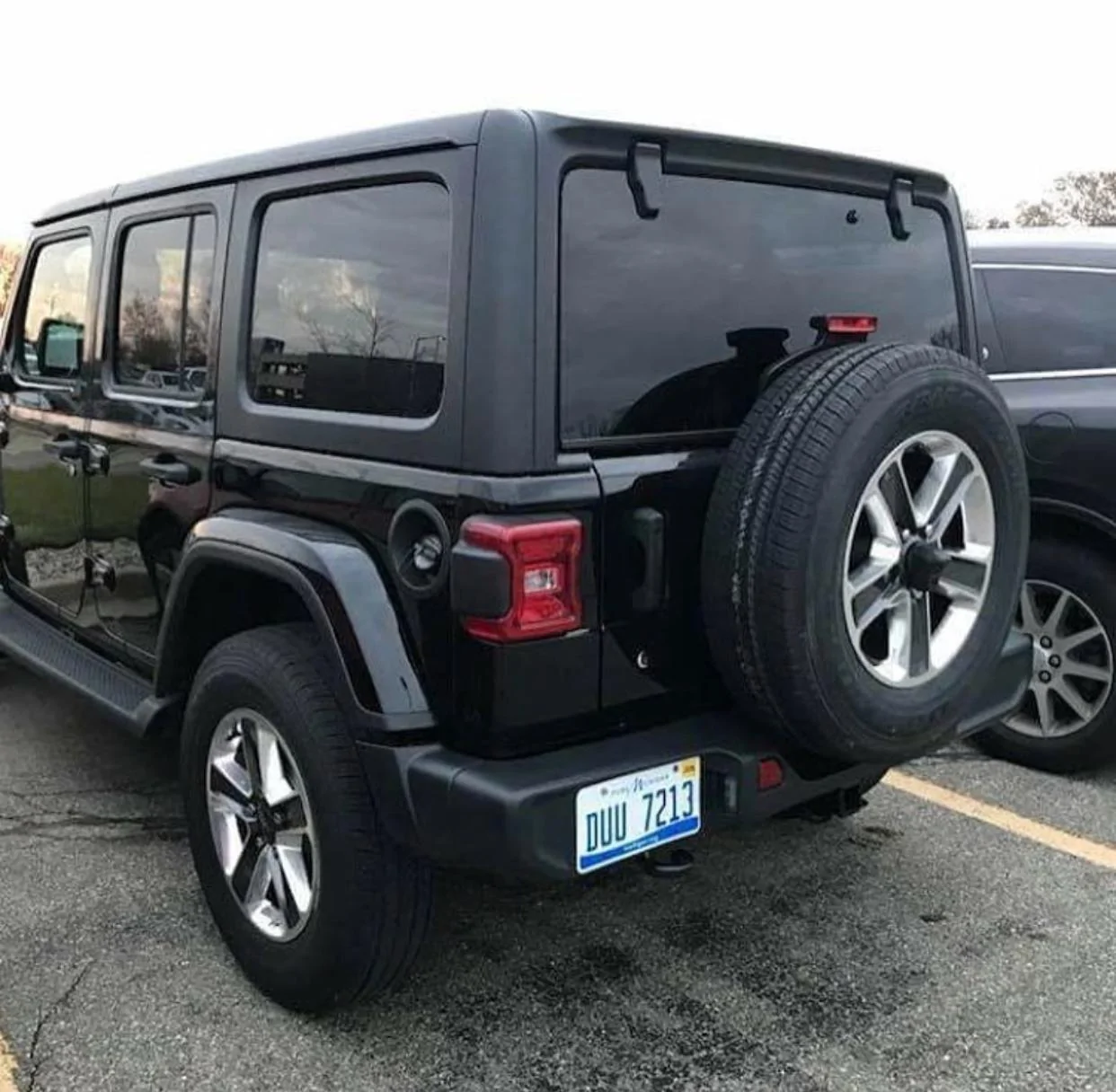 black-2018-Jeep-Wrangler-Unlimited-Sahara-C.webp