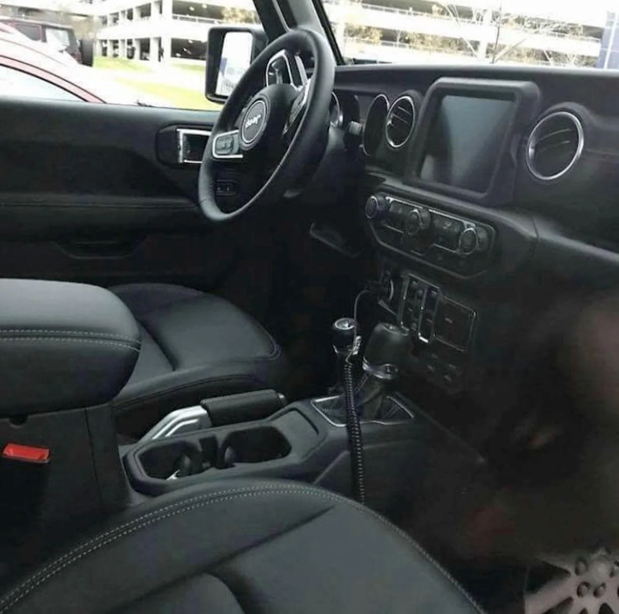 black-2018-Jeep-Wrangler-Unlimited-Sahara-D.webp