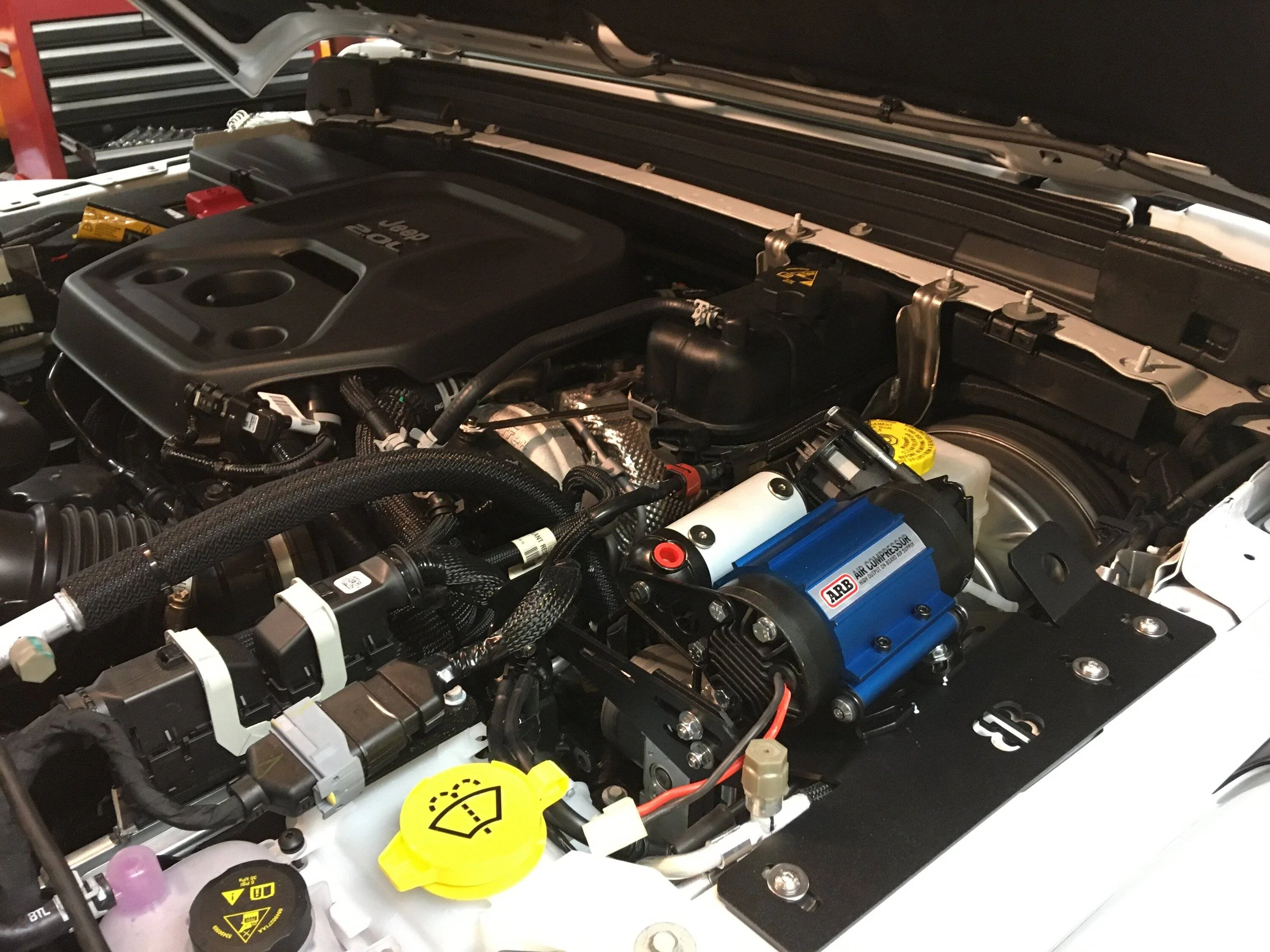 Jeep Wrangler JL Driver Side Fender Under Hood ARB Single Compressor Mount ARB 813 Bracket Install 02 022722