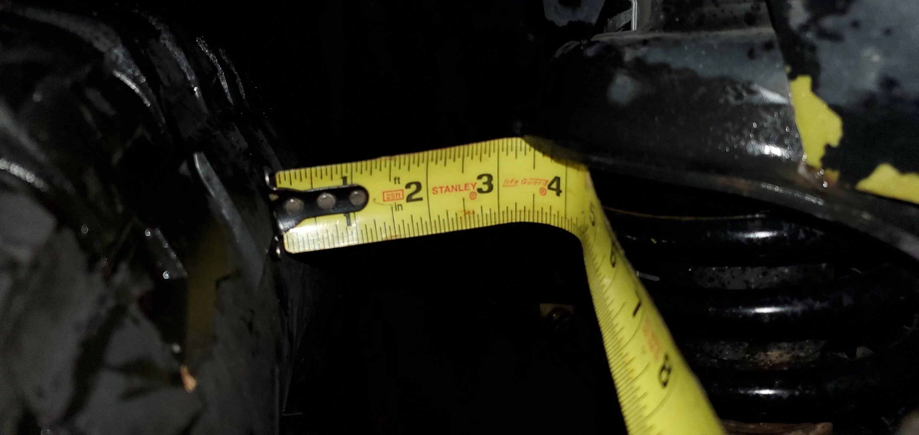 Passenger spring perch to tire.jpg